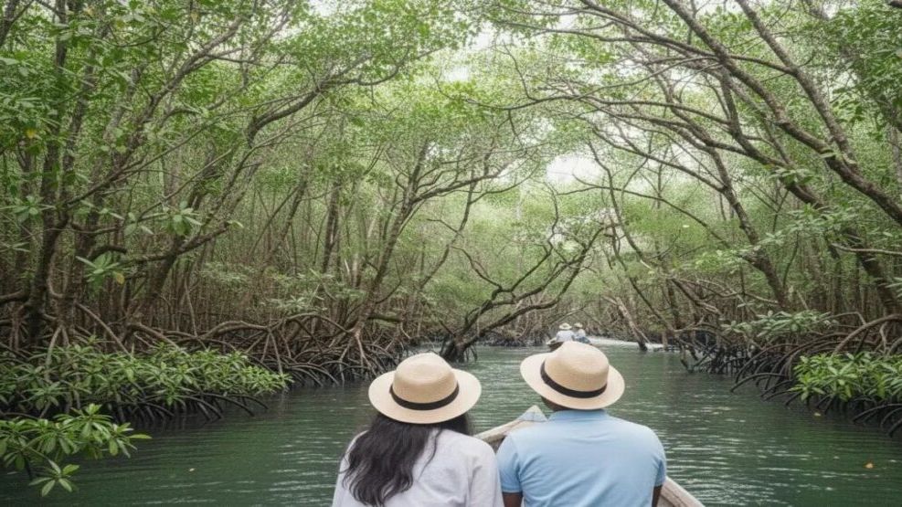 Tourists traveling by boat through dense mangrove forests on the way to Limestone Cave, Baratang Island, Andaman