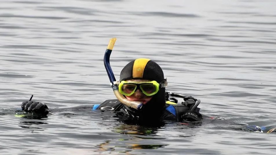 Tourist enjoying snorkeling at Elephanta Beach, Havelock Island